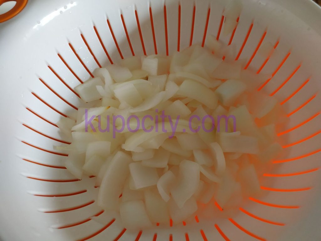 Chop and wash a whole white onion.