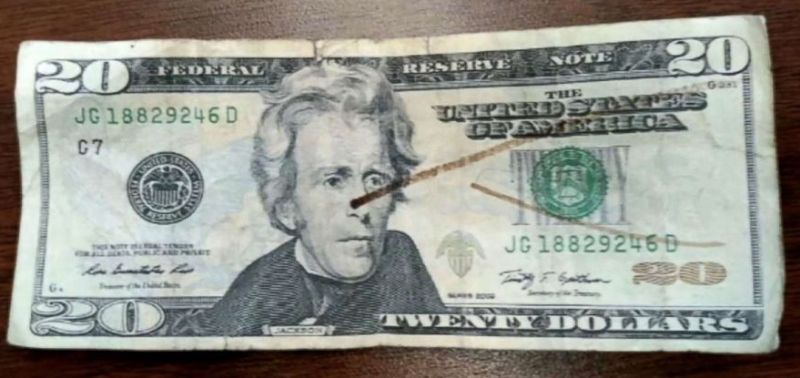 Twenty dollar bill with counterfeit detecting ink